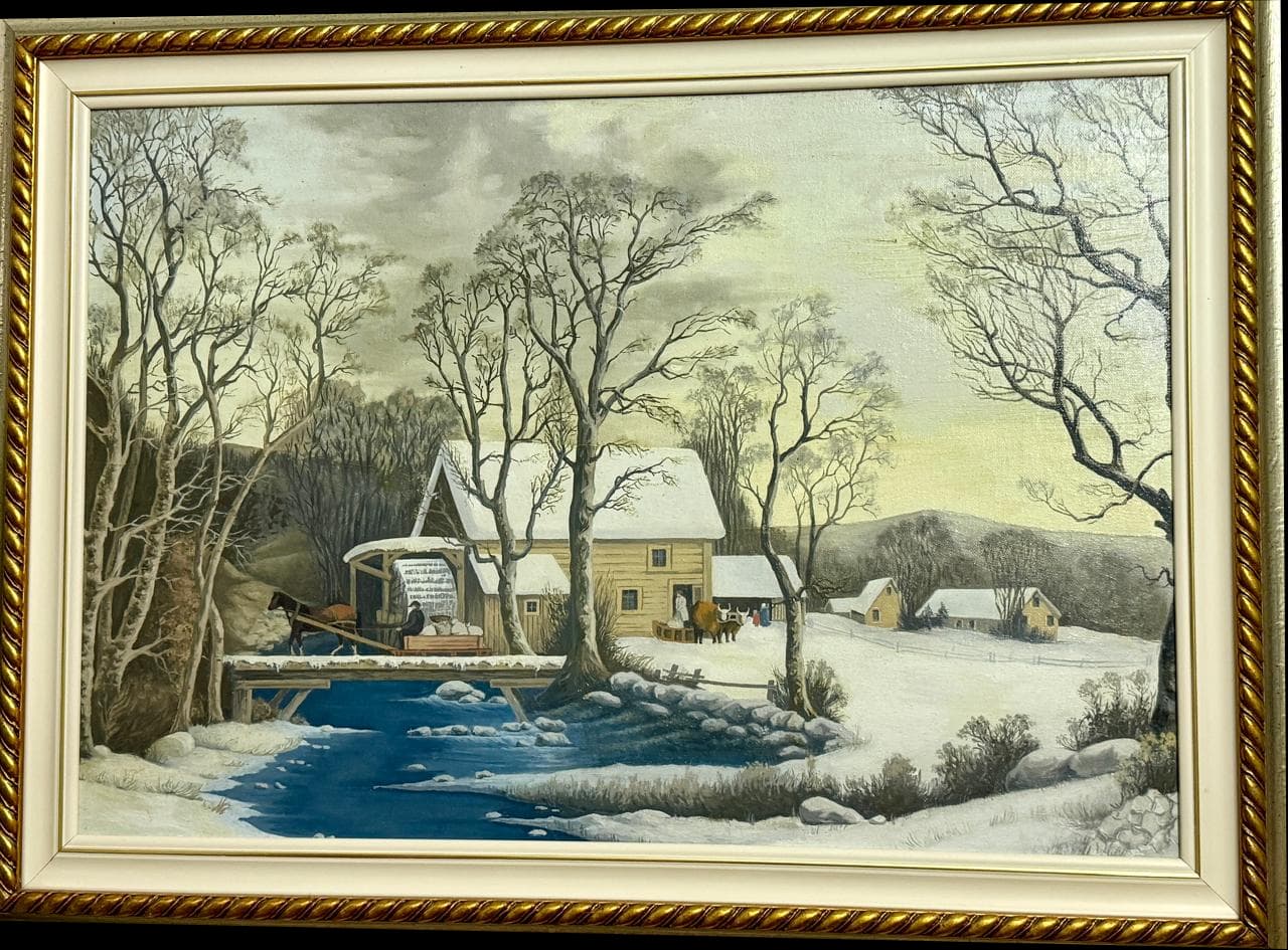 A gold-framed winter landscape with a river, bare trees, and snow-covered houses