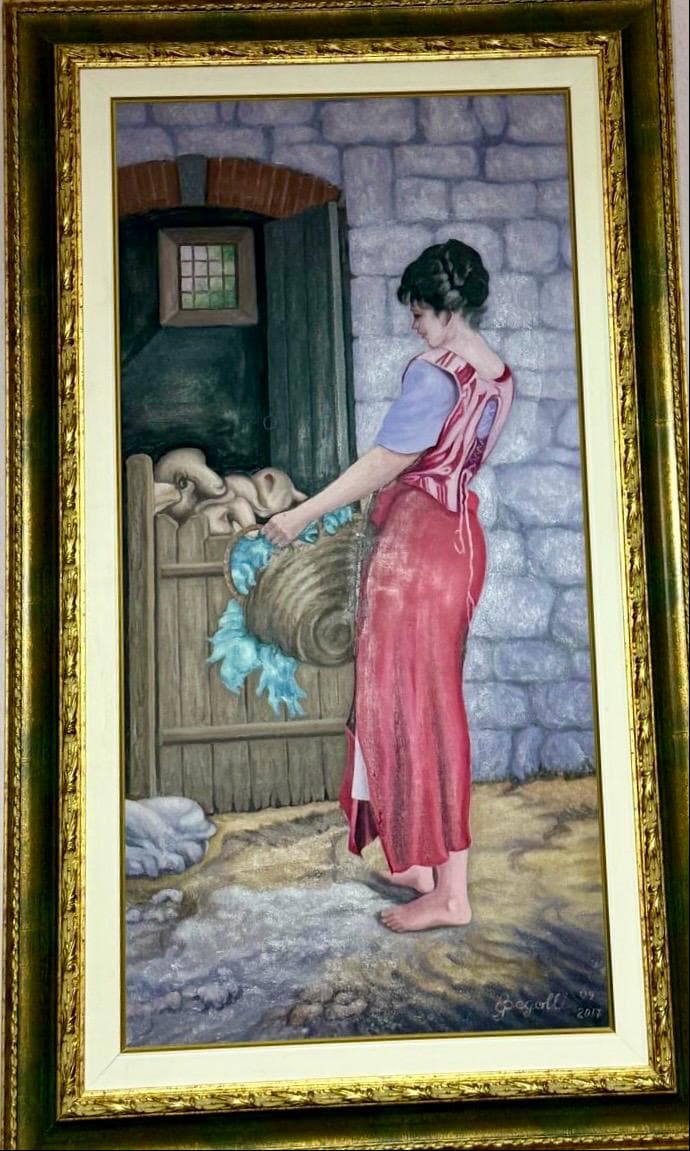 A woman in a long pink dress filling a blue vessel at a stone fountain, in a dark gold frame